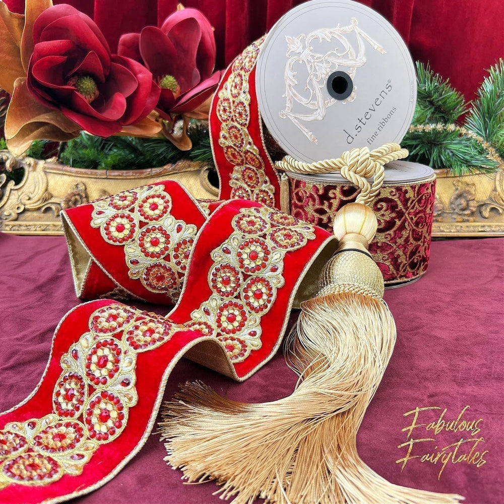 Luxurious red velvet Christmas ribbon by D. Stevens with gold beaded details, styled alongside a decorative tassel.