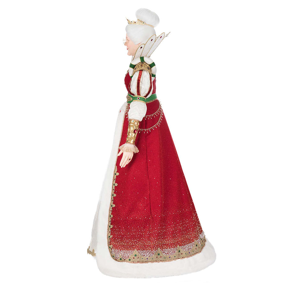 Side profile of Queen Noelle Claus luxury holiday display figure wearing velvet gown with gold embroidery
