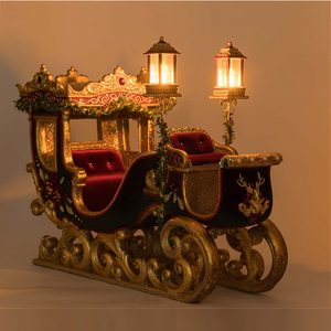 Katherine’s Collection festive sleigh adorned with sequined poinsettias and beaded florals