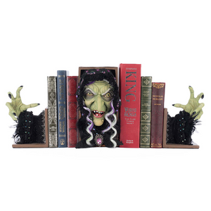 Halloween witch bookend with Grizelda emerging from decorative spell books
