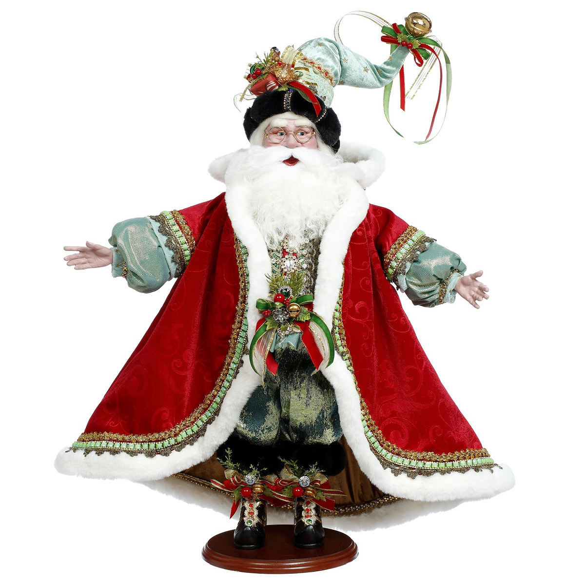 Decorative Mark Roberts Yuletide Santa in red and green outfit for Christmas display