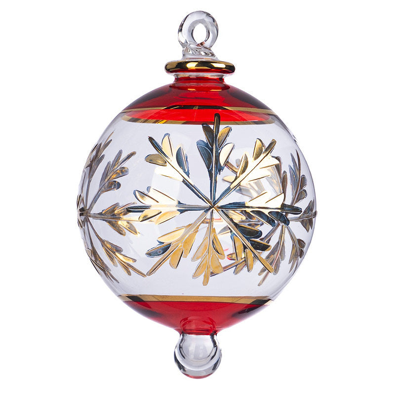 Hand-blown clear glass Christmas ornament with red rim and gold snowflake design.